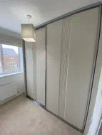 Sahara design wrapped sliding wardrobe in mussel with gun metal frames, fitted in Ingleby Barwick